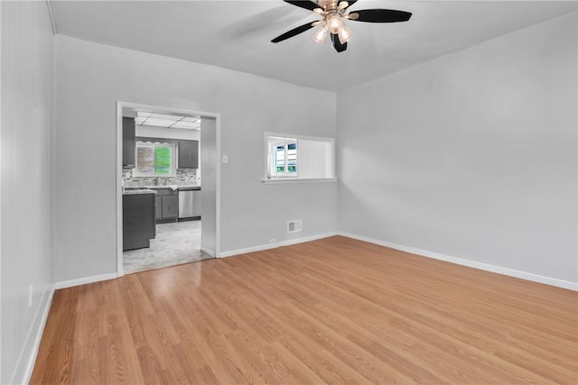 880 Patton St, Monroeville, PA 15146 - empty room featuring ceiling fan, light wood-type flooring, and healthy amount of natural light