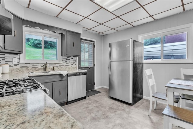 880 Patton St, Monroeville, PA 15146 - kitchen featuring appliances with stainless steel finishes, plenty of natural light, gray cabinetry, and decorative backsplash