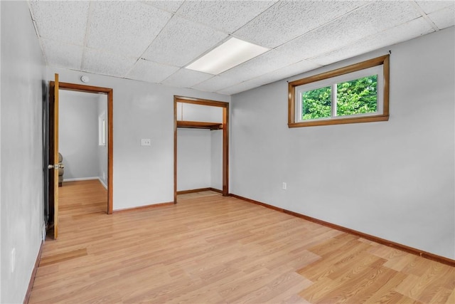 880 Patton St, Monroeville, PA 15146 - unfurnished bedroom featuring light wood-style flooring, a paneled ceiling, and a closet