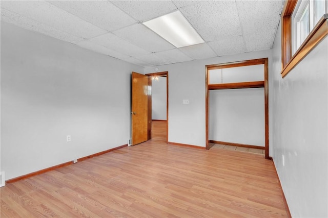 880 Patton St, Monroeville, PA 15146 - unfurnished bedroom with light wood finished floors, a drop ceiling, and a closet