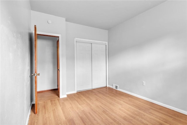 880 Patton St, Monroeville, PA 15146 - unfurnished bedroom with light wood-style floors and a closet