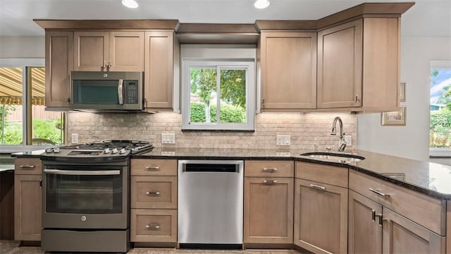 77 Ridgecrest Dr, Wilkins Twp, PA 15235 - kitchen featuring appliances with stainless steel finishes, dark stone counters, backsplash, and recessed lighting