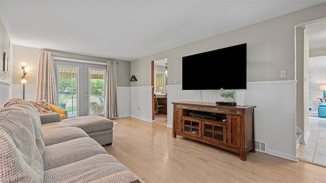 77 Ridgecrest Dr, Wilkins Twp, PA 15235 - living room featuring wainscoting and light wood-style floors