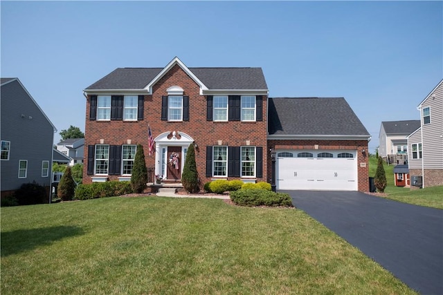107 Marias Way S, Park, PA 15129 - colonial inspired home with brick siding, a garage, driveway, a front lawn, and roof with shingles
