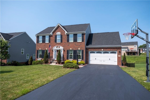 107 Marias Way S, Park, PA 15129 - colonial house featuring an attached garage, brick siding, driveway, and a front lawn