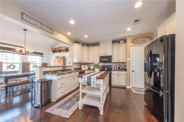 107 Marias Way S, Park, PA 15129 - kitchen with black appliances, a peninsula, dark wood-style floors, vaulted ceiling, and recessed lighting