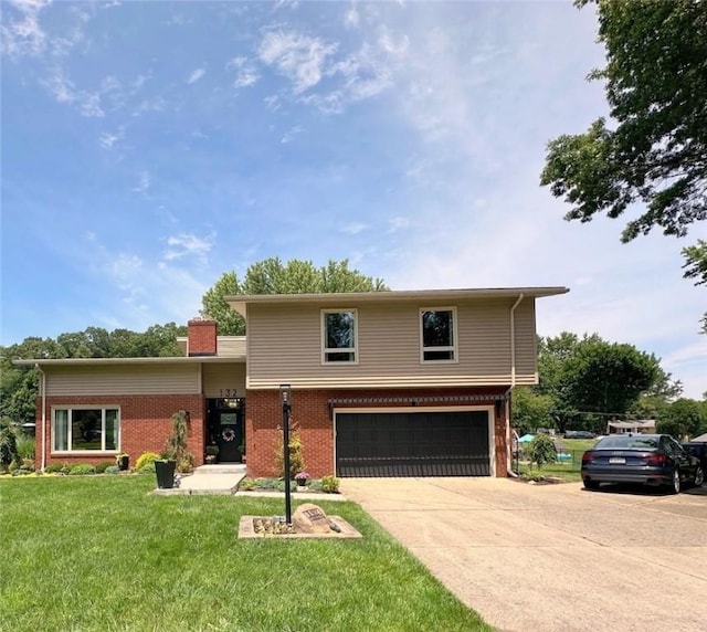 132 Terrace Dr, North Sewickley Twp, PA 16117 - view of front of property with an attached garage, brick siding, driveway, a front yard, and a chimney