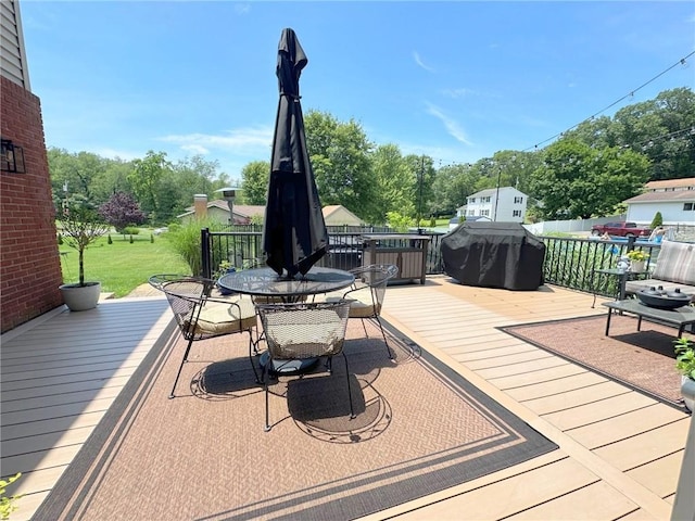 132 Terrace Dr, North Sewickley Twp, PA 16117 - wooden terrace with outdoor dining space, area for grilling, and view of wooded area