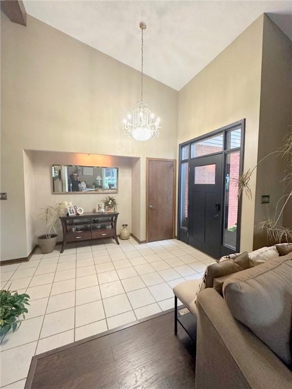 132 Terrace Dr, North Sewickley Twp, PA 16117 - entrance foyer with high vaulted ceiling, a chandelier, and light wood-style floors