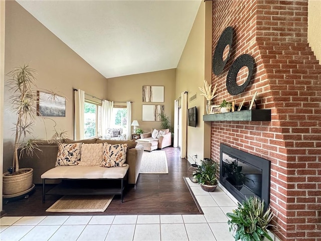 132 Terrace Dr, North Sewickley Twp, PA 16117 - living room with a brick fireplace, light tile patterned floors, and high vaulted ceiling