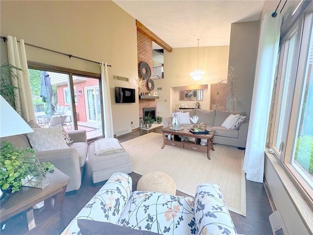 132 Terrace Dr, North Sewickley Twp, PA 16117 - living area featuring healthy amount of natural light, a high ceiling, dark wood-style flooring, and a fireplace