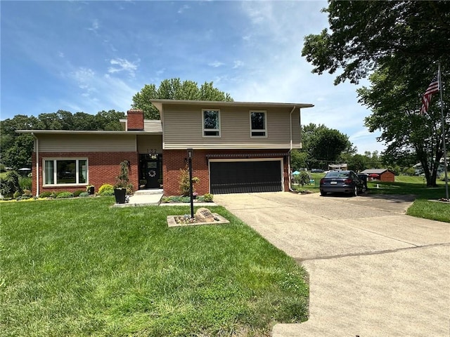 132 Terrace Dr, North Sewickley Twp, PA 16117 - tri-level home with a garage, driveway, brick siding, a front yard, and a chimney