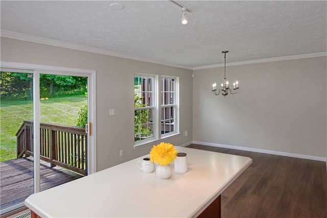 651 Village Green Blvd E, Adams Twp, PA 16046 - dining space featuring healthy amount of natural light, dark wood-style floors, a chandelier, crown molding, and a textured ceiling