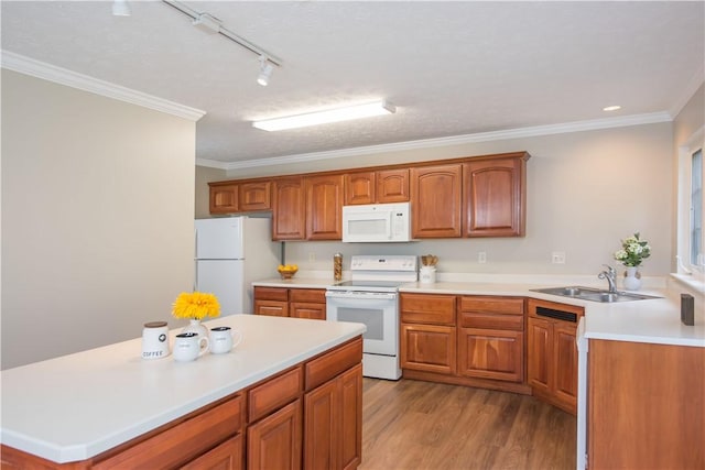 651 Village Green Blvd E, Adams Twp, PA 16046 - kitchen featuring white appliances, light wood-style flooring, crown molding, light countertops, and brown cabinets