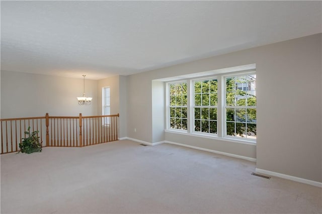 651 Village Green Blvd E, Adams Twp, PA 16046 - spare room featuring light carpet and a chandelier