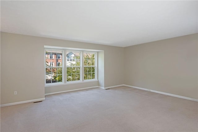 651 Village Green Blvd E, Adams Twp, PA 16046 - spare room featuring baseboards and light colored carpet
