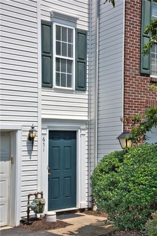 651 Village Green Blvd E, Adams Twp, PA 16046 - property entrance featuring brick siding