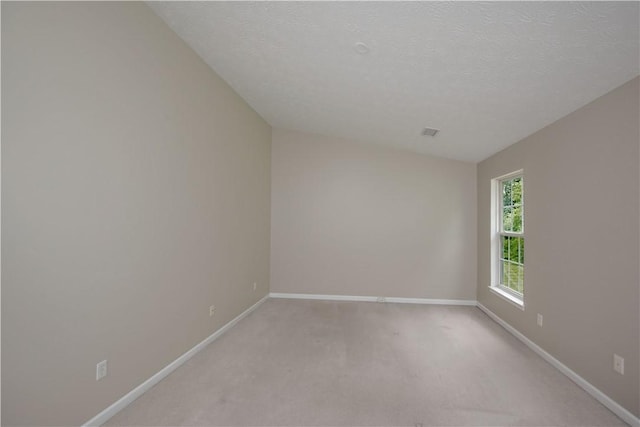 651 Village Green Blvd E, Adams Twp, PA 16046 - empty room featuring light carpet and a textured ceiling