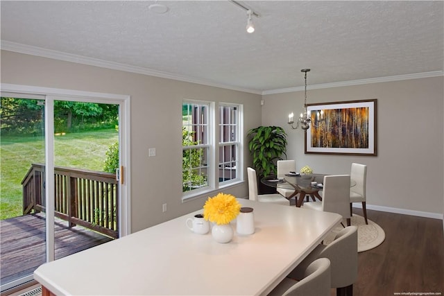 651 Village Green Blvd E, Adams Twp, PA 16046 - dining space featuring wood finished floors, a chandelier, crown molding, a textured ceiling, and rail lighting