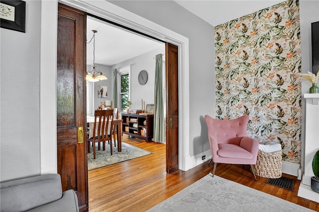 3238 Gaylord Ave, Dormont, PA 15216 - living area with a chandelier, wood finished floors, and wallpapered walls
