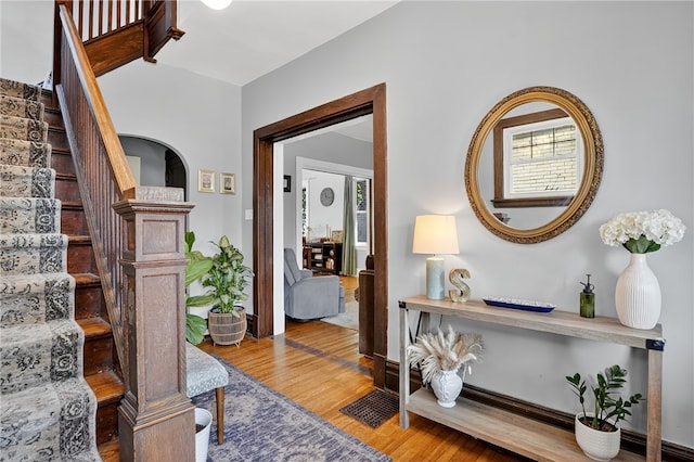 3238 Gaylord Ave, Dormont, PA 15216 - staircase featuring wood finished floors, plenty of natural light, and arched walkways