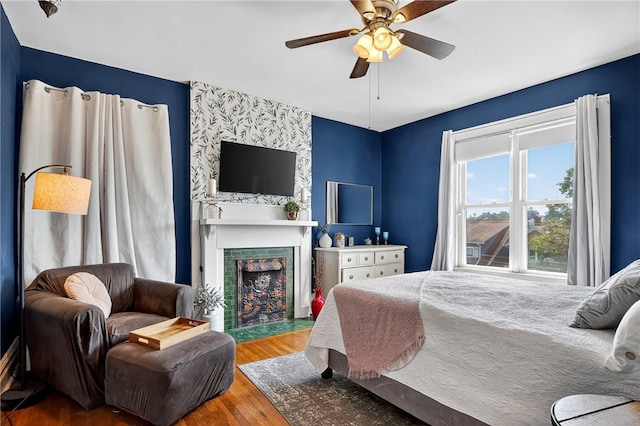 3238 Gaylord Ave, Dormont, PA 15216 - bedroom with wood finished floors, a tiled fireplace, and ceiling fan