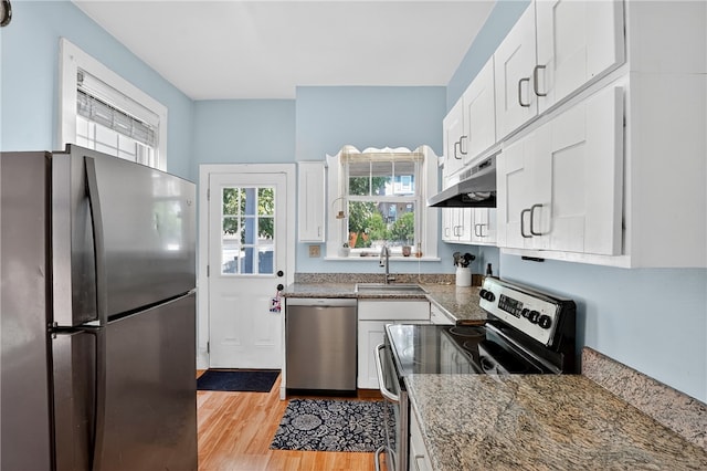 3238 Gaylord Ave, Dormont, PA 15216 - kitchen with stainless steel appliances, under cabinet range hood, light wood-style flooring, white cabinets, and stone countertops