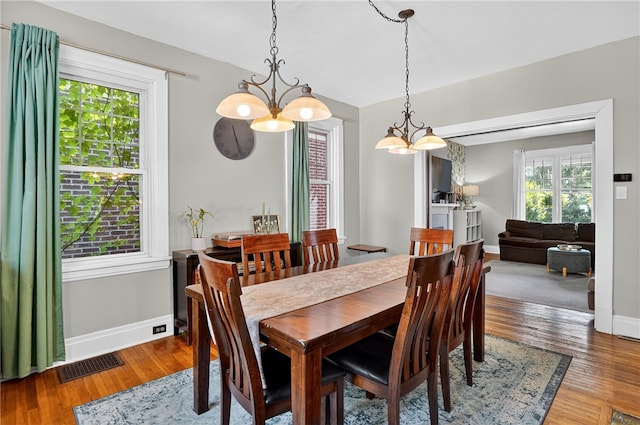 3238 Gaylord Ave, Dormont, PA 15216 - dining space featuring a chandelier, healthy amount of natural light, and wood finished floors