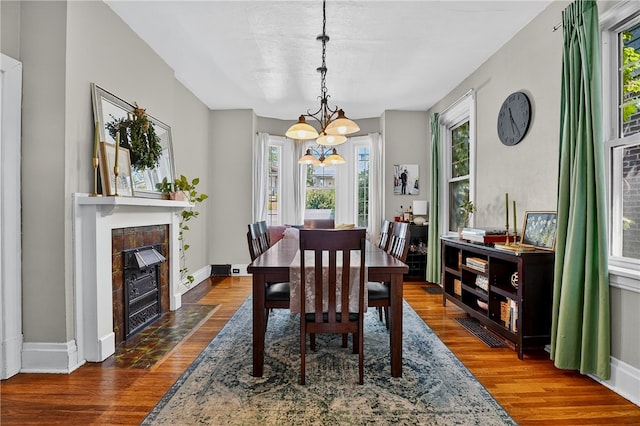 3238 Gaylord Ave, Dormont, PA 15216 - dining space with healthy amount of natural light, dark wood finished floors, and a chandelier
