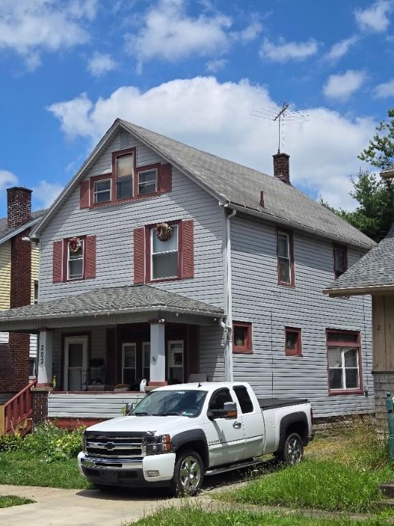 203 Baldwin Ave, Sharon, PA 16146 - view of front of home featuring a chimney