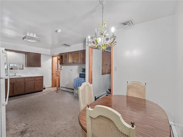 318 Penn Ave, Aliquippa, PA 15001 - dining space featuring a baseboard radiator and a chandelier