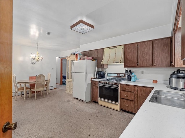 318 Penn Ave, Aliquippa, PA 15001 - kitchen featuring white appliances, ventilation hood, a chandelier, light countertops, and baseboard heating