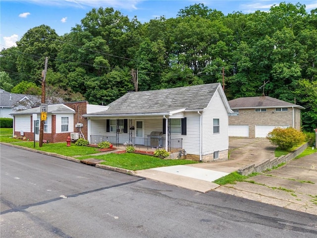 318 Penn Ave, Aliquippa, PA 15001 - bungalow with a porch, an outdoor structure, and a garage