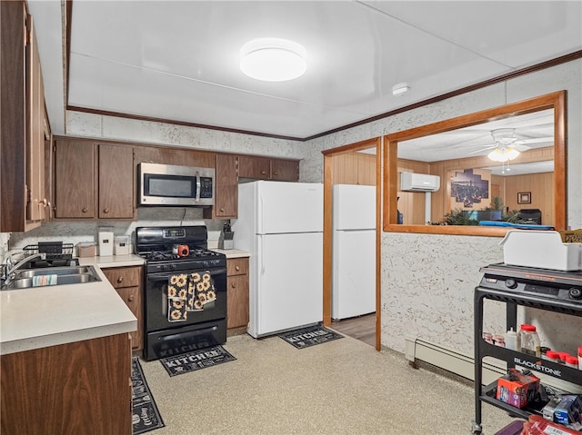 318 Penn Ave, Aliquippa, PA 15001 - kitchen featuring black range with gas cooktop, freestanding refrigerator, stainless steel microwave, and an AC wall unit
