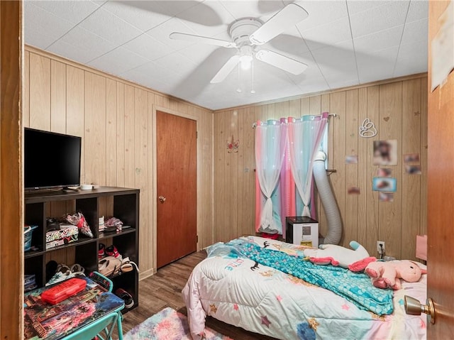 318 Penn Ave, Aliquippa, PA 15001 - bedroom with wood finished floors, wooden walls, and a ceiling fan