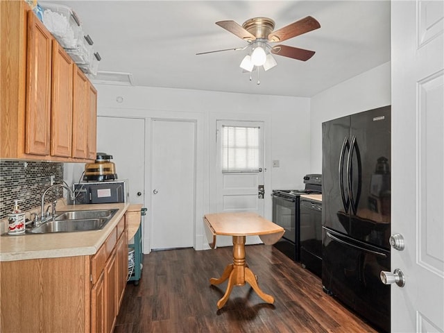 318 Penn Ave, Aliquippa, PA 15001 - kitchen featuring black appliances, light countertops, tasteful backsplash, a ceiling fan, and dark wood-type flooring