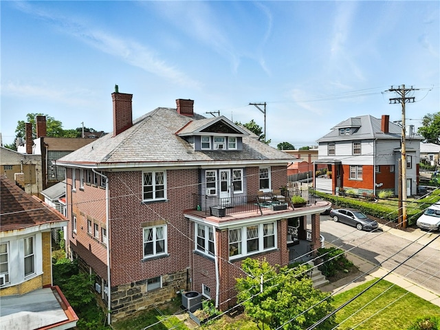 3100 Wainbell Ave, Dormont, PA 15216 - back of property with a high end roof, brick siding, and a chimney