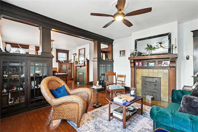 3100 Wainbell Ave, Dormont, PA 15216 - sitting room featuring a tile fireplace, decorative columns, a ceiling fan, and hardwood / wood-style flooring