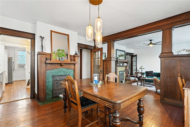 3100 Wainbell Ave, Dormont, PA 15216 - dining room featuring a fireplace, wood-type flooring, and ceiling fan