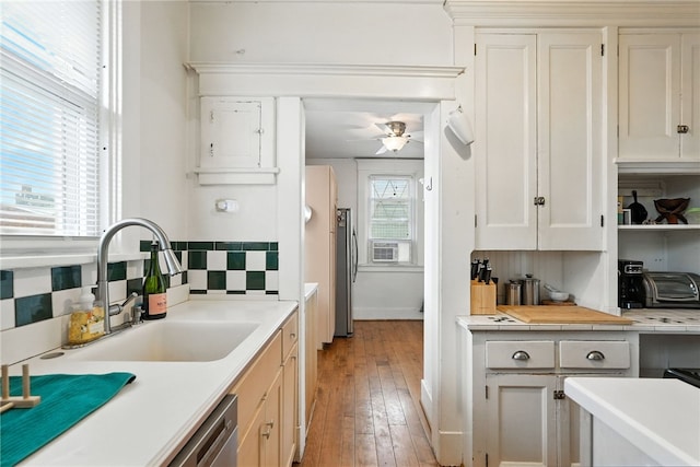 3100 Wainbell Ave, Dormont, PA 15216 - kitchen with light countertops, ceiling fan, backsplash, stainless steel appliances, and light wood-style floors