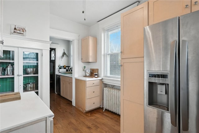 3100 Wainbell Ave, Dormont, PA 15216 - kitchen featuring stainless steel fridge, radiator heating unit, wood finished floors, and light countertops