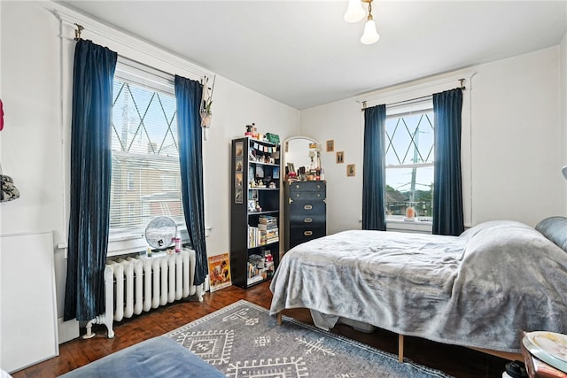 3100 Wainbell Ave, Dormont, PA 15216 - bedroom featuring radiator heating unit, multiple windows, and wood finished floors
