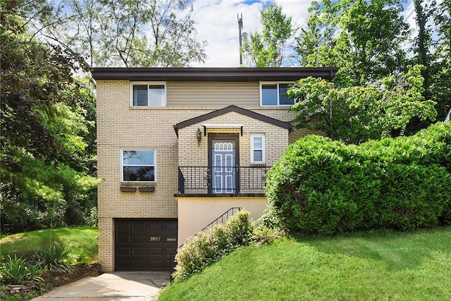 3931 Boulevard Dr, Squirrel Hill, PA 15217 - view of front of home featuring an attached garage, a front yard, concrete driveway, and brick siding