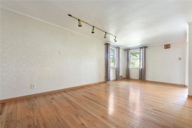 3931 Boulevard Dr, Squirrel Hill, PA 15217 - empty room with ornamental molding, track lighting, and wood finished floors