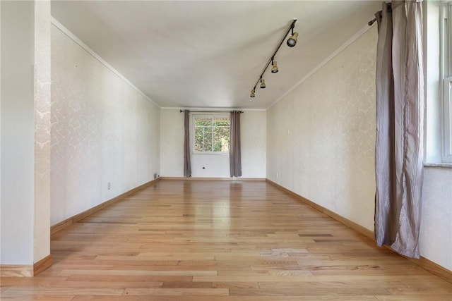 3931 Boulevard Dr, Squirrel Hill, PA 15217 - empty room featuring crown molding, light wood finished floors, track lighting, and a textured wall