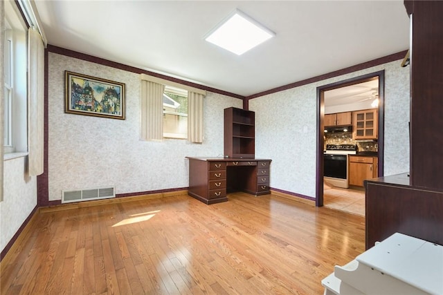 3931 Boulevard Dr, Squirrel Hill, PA 15217 - unfurnished living room featuring light wood-type flooring, wallpapered walls, and ornamental molding