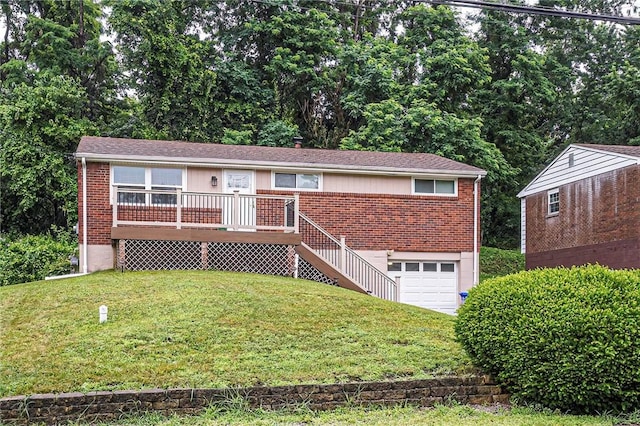 125 Holstein Dr, North Fayette, PA 15071 - single story home with brick siding, an attached garage, a front yard, and a deck