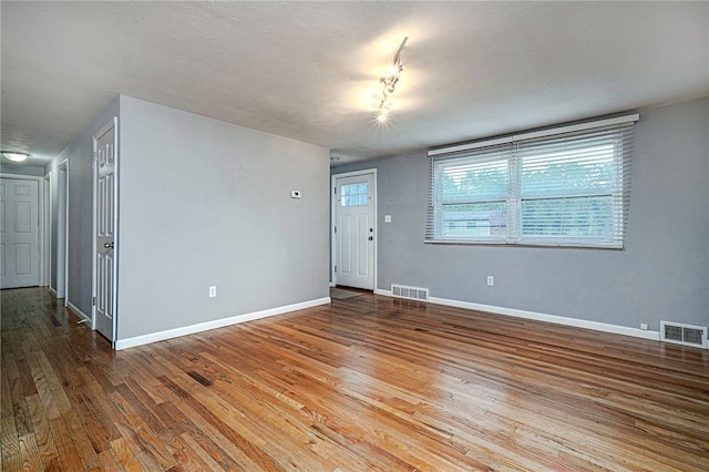 125 Holstein Dr, North Fayette, PA 15071 - unfurnished living room with hardwood / wood-style floors and baseboards
