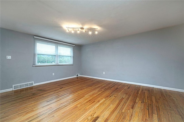 125 Holstein Dr, North Fayette, PA 15071 - unfurnished room with hardwood / wood-style flooring and track lighting