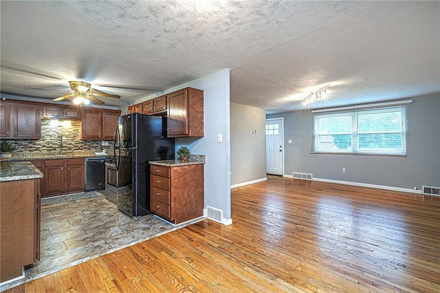 125 Holstein Dr, North Fayette, PA 15071 - kitchen with dishwasher, freestanding refrigerator, backsplash, a ceiling fan, and open floor plan